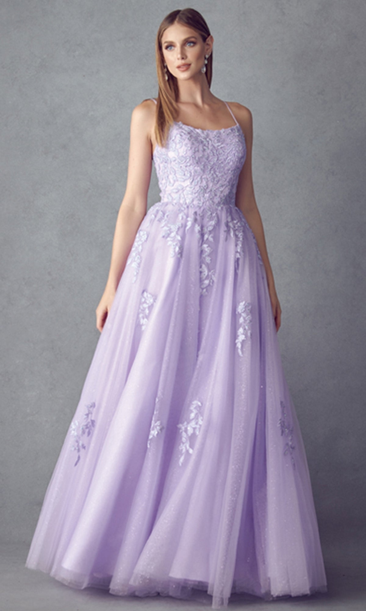 A woman wearing the Corset-Back Long Glitter-Tulle Prom Ball Gown 260 stands against a plain gray background.